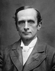 A person in a suit
Description automatically generated